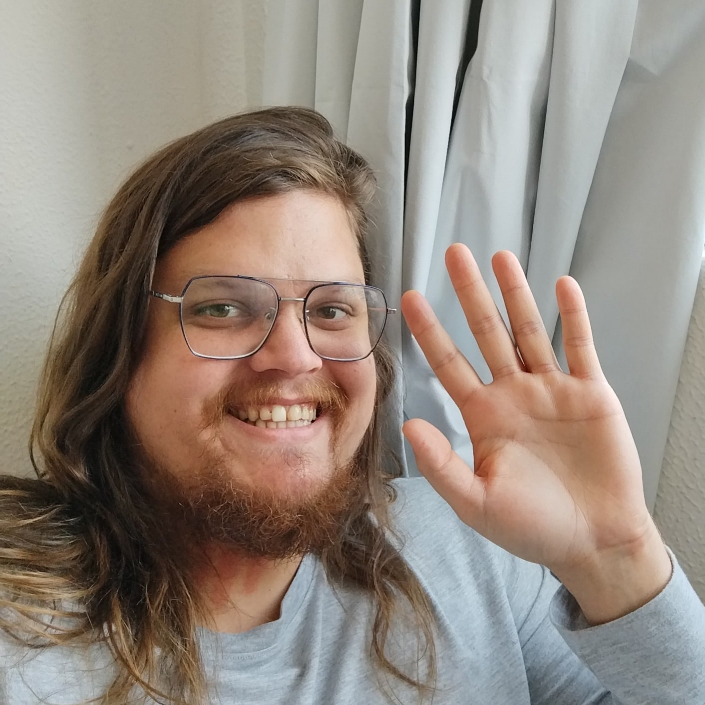 It's me smiling and waving